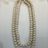 A fashionable and trendy stainless steel necklace with multiple sets of off-white glass beads details Picture